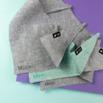 Dog bandana in gray and turquoise with an individual name stick